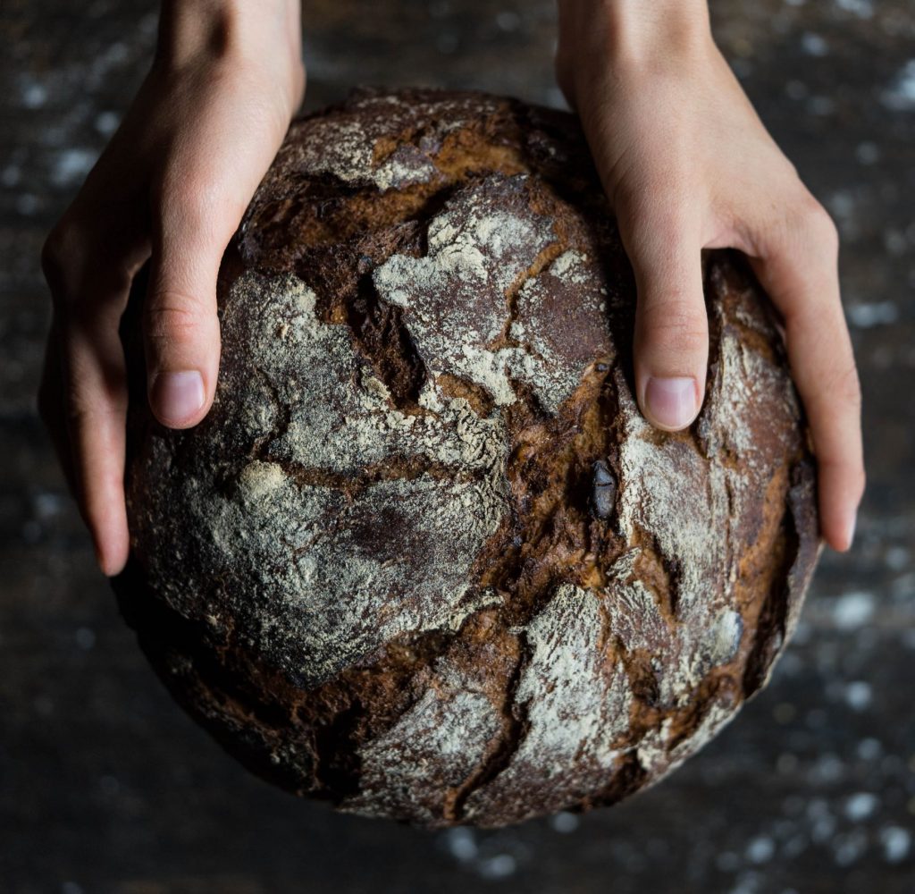 human-holding-a-bread-745988
